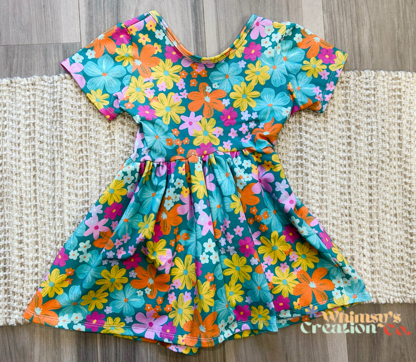 FLOWERS ON TEAL PEPLUM